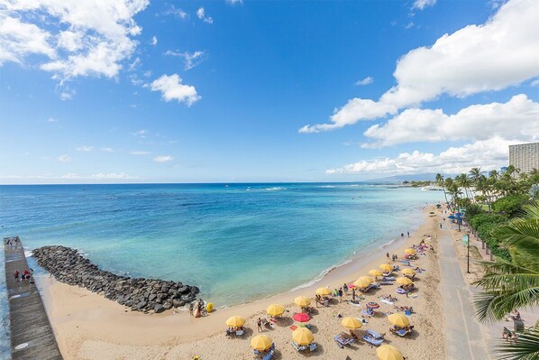 On the beach, sun-loungers, beach umbrellas