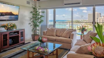 Deluxe Room, 2 Bedrooms, Ocean View | Living area | Flat-screen TV