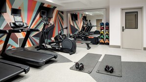A gym with treadmills, elliptical machines, and weight equipment. - Hilton Garden Inn Folsom (Folsom)