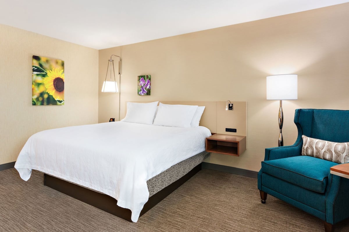 Premium bedding, desk, laptop workspace, iron/ironing board