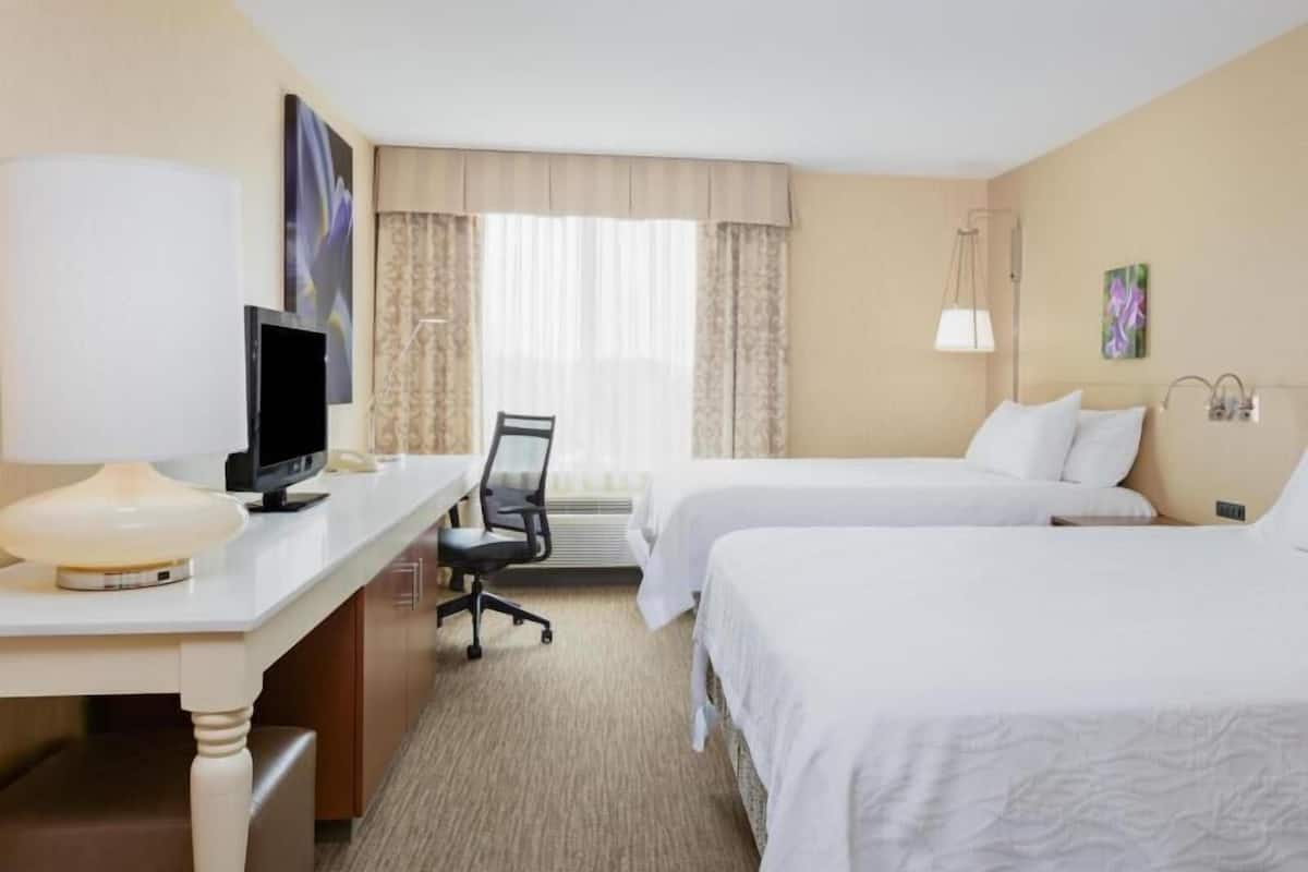 Premium bedding, desk, laptop workspace, iron/ironing board