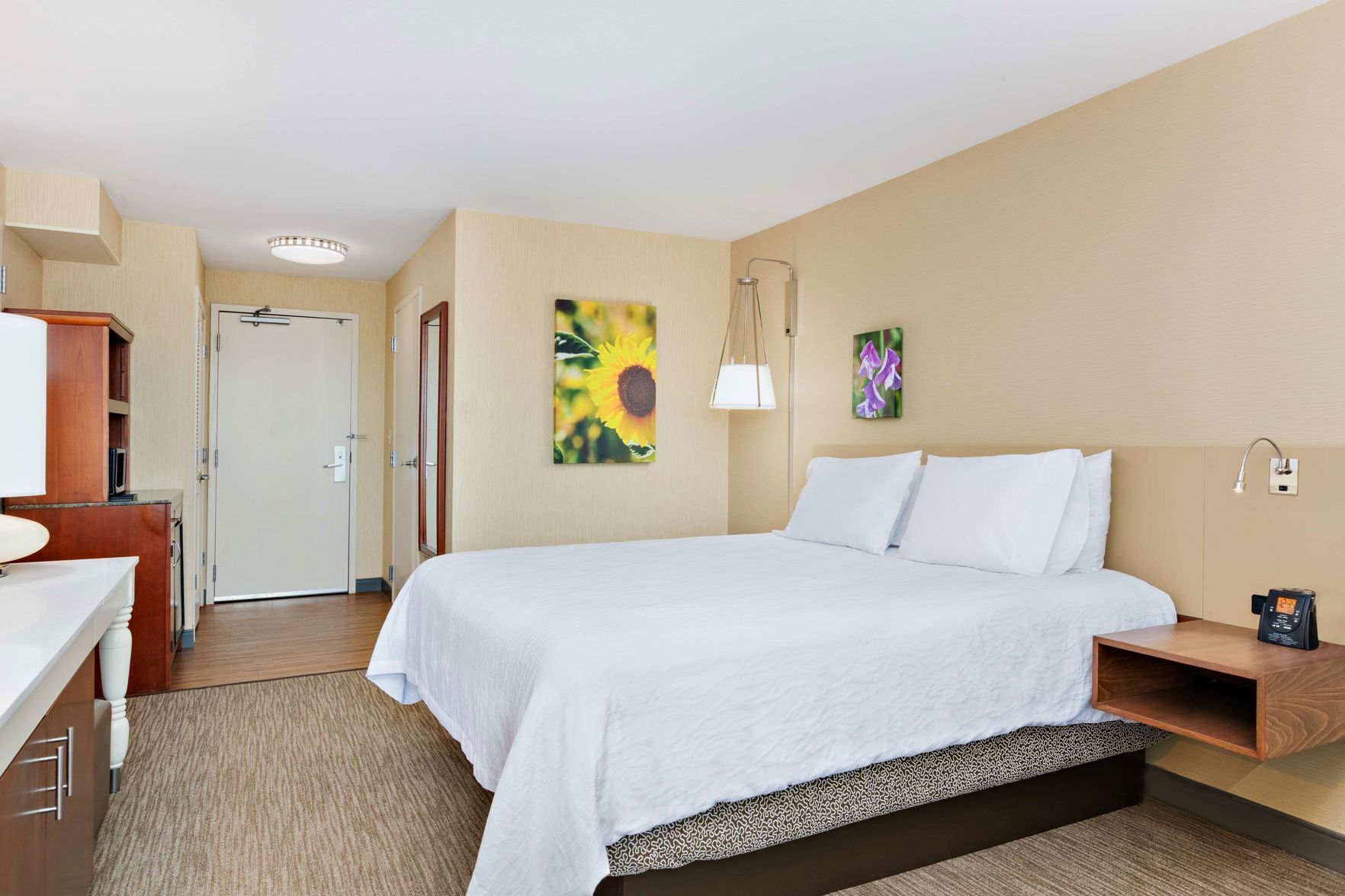 Premium bedding, desk, laptop workspace, iron/ironing board