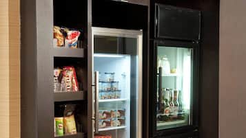 A vending machine with snacks and beverages, labeled "the market".