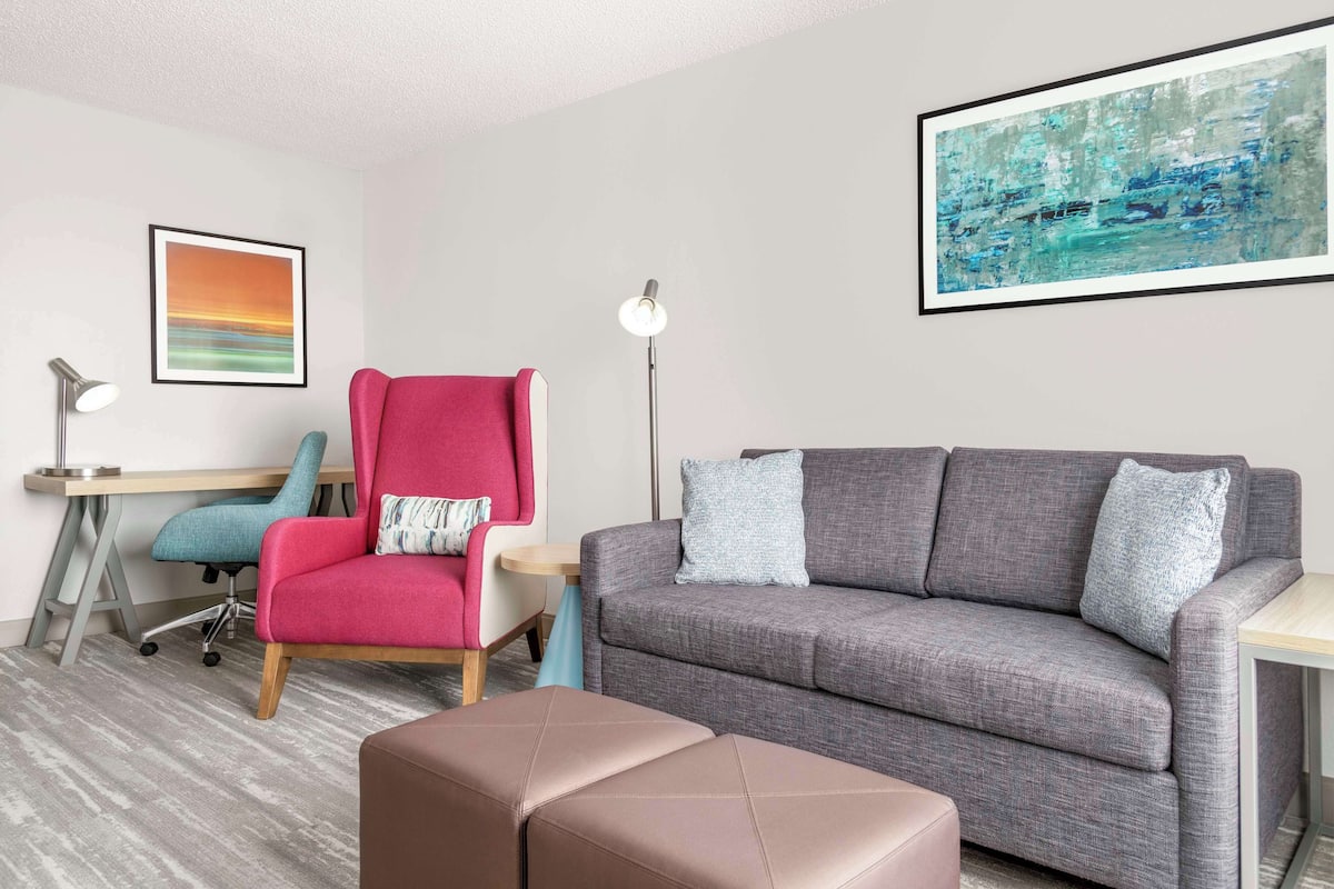 junior suite, 1 bedroom | living area | 49-inch lcd tv with satellite channels, tv, first-run films