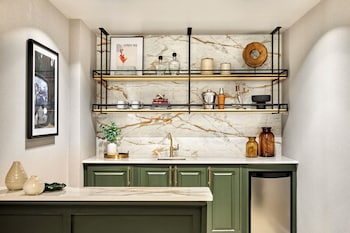 Hotel amenities such as safe, desk and work area at Omni Interlocken