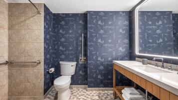 Deluxe Room, 1 King Bed, Accessible (Classic ADA) | Bathroom | Combined shower/tub, hair dryer, bathrobes, slippers