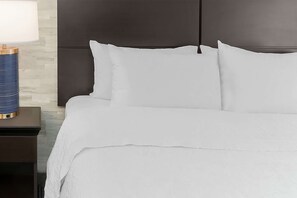 Down comforters, pillowtop beds, in-room safe, desk