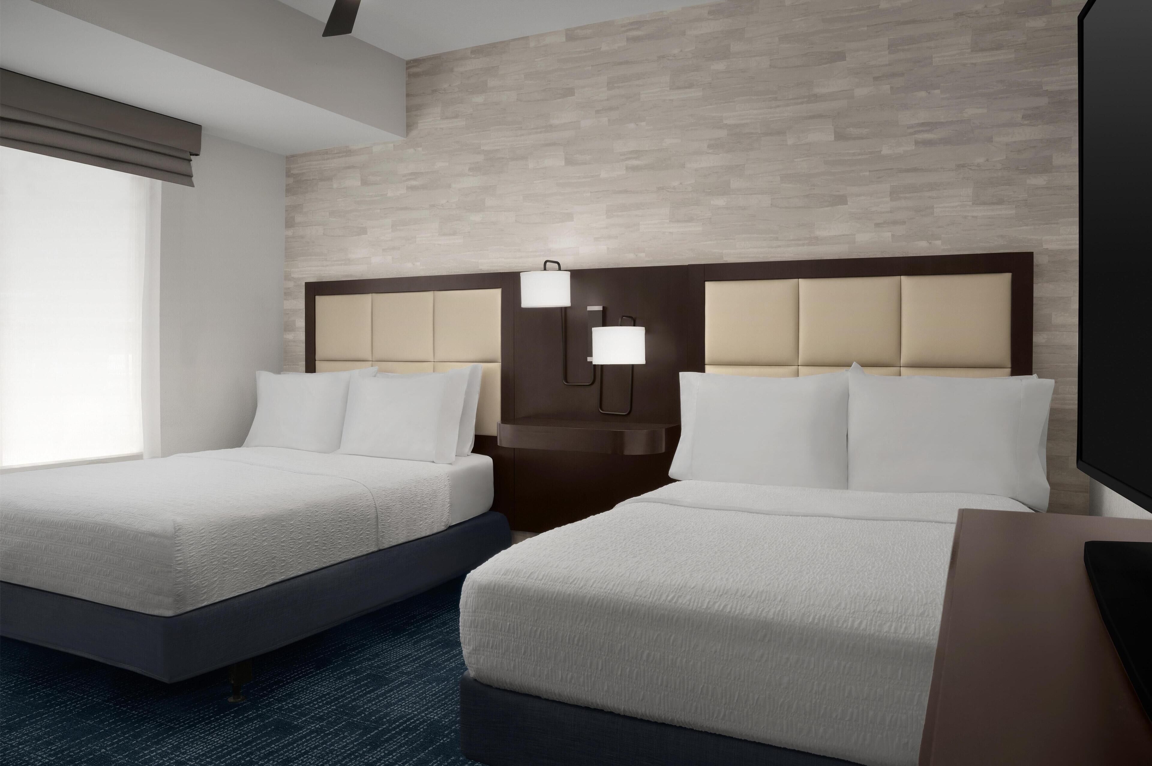 Down comforters, pillowtop beds, desk, laptop workspace