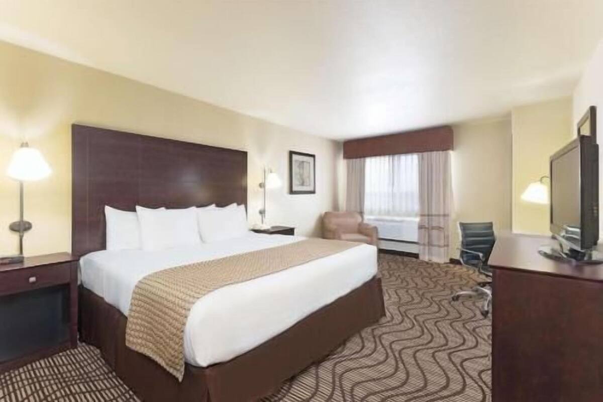Premium bedding, desk, blackout drapes, iron/ironing board