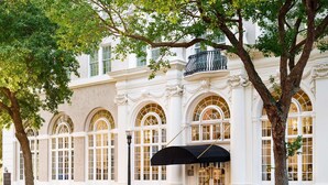 A historic building with arched windows and a black awning. - The Terrace Hotel Lakeland, Tapestry Collection by Hilton (Lakeland)