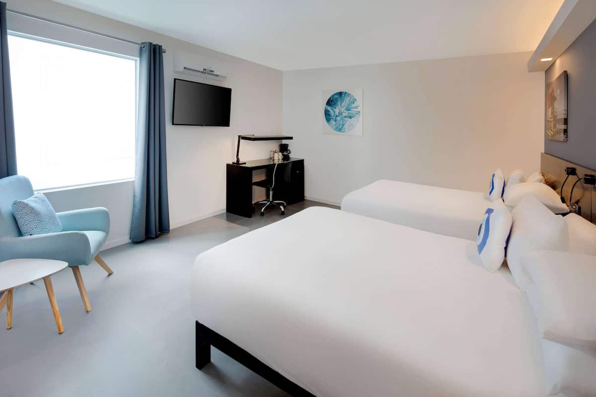 Premium bedding, memory-foam beds, in-room safe, desk