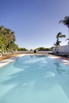 Outdoor pool, open 8:00 AM to 9:00 PM, free cabanas, pool umbrellas at MB Hotel, Trademark Collection by Wyndham