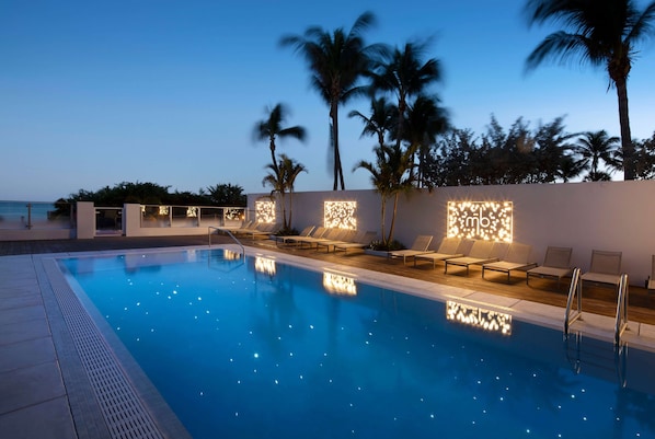 Outdoor pool, open 8:00 AM to 9:00 PM, free cabanas, pool umbrellas