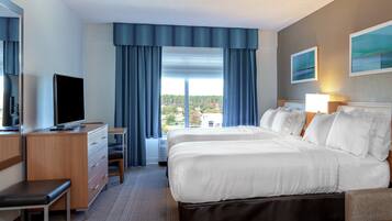 Premium bedding, desk, laptop workspace, blackout drapes