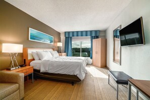 Premium bedding, desk, laptop workspace, blackout curtains