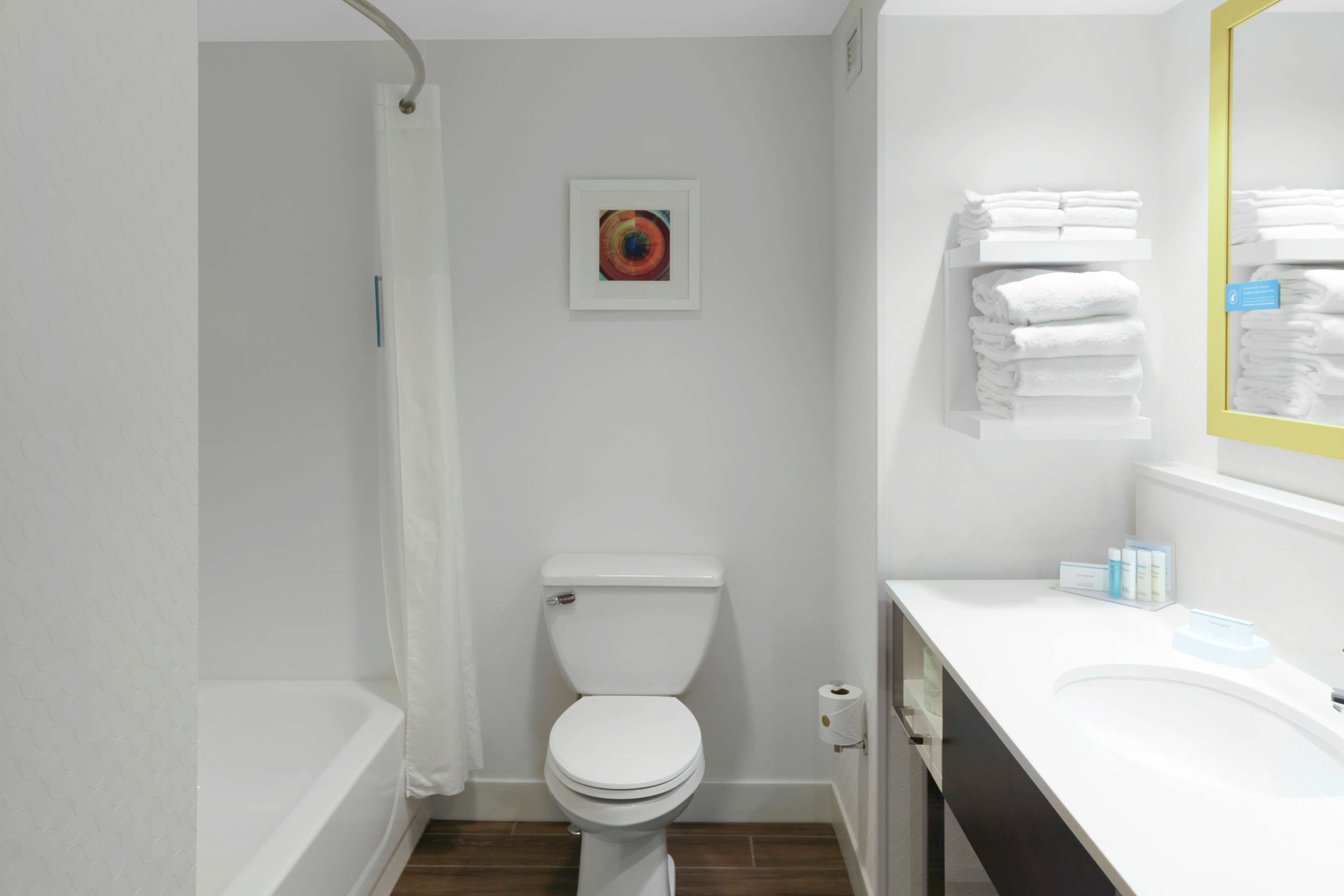 room, 2 queen beds, refrigerator & microwave | bathroom | combined shower/bathtub, hair dryer, towels, soap