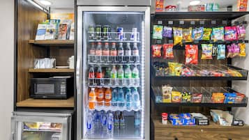 A vending machine stocked with various beverages and snacks.