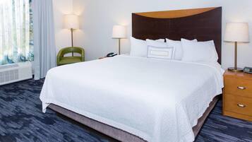 Down comforters, desk, blackout drapes, iron/ironing board