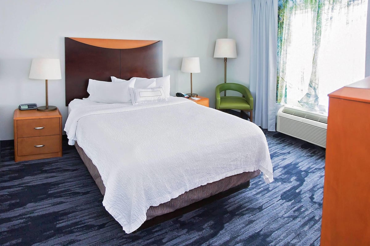 Down comforters, desk, blackout drapes, iron/ironing board