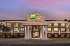 A Holiday Inn Express & Suites building with a prominent entrance, large windows, and a brick facade. - Holiday Inn Express Hotel & Suites Natchitoches by IHG (Natchitoches)