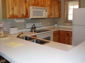 Condo, 3 Bedrooms | Private kitchen | Fridge, microwave, stovetop, dishwasher