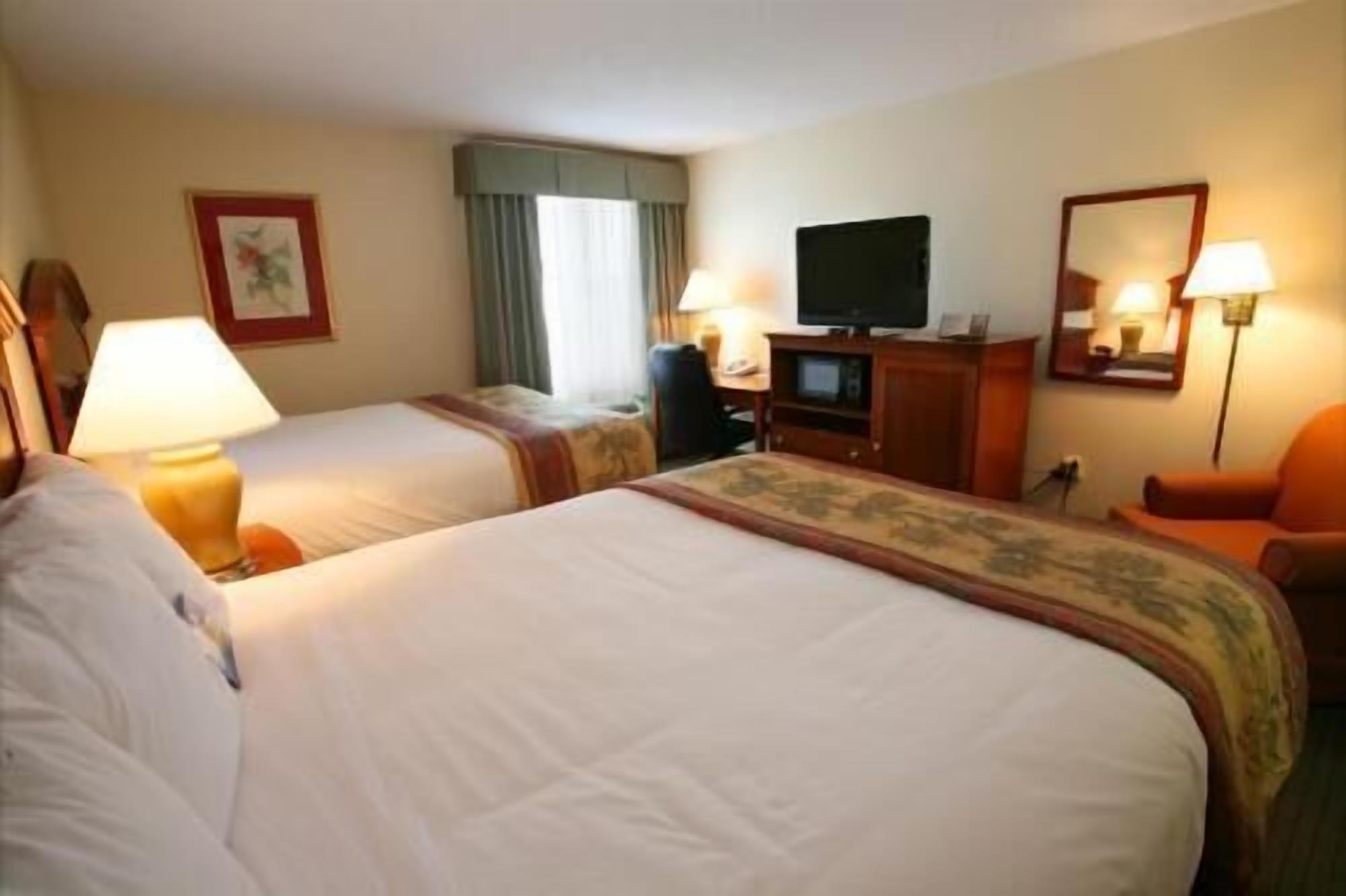 Premium bedding, desk, laptop workspace, blackout curtains