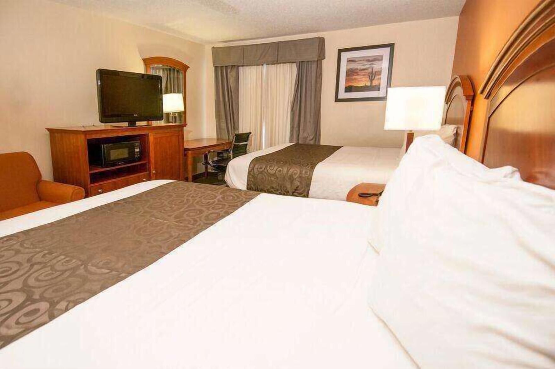 Premium bedding, desk, laptop workspace, blackout curtains
