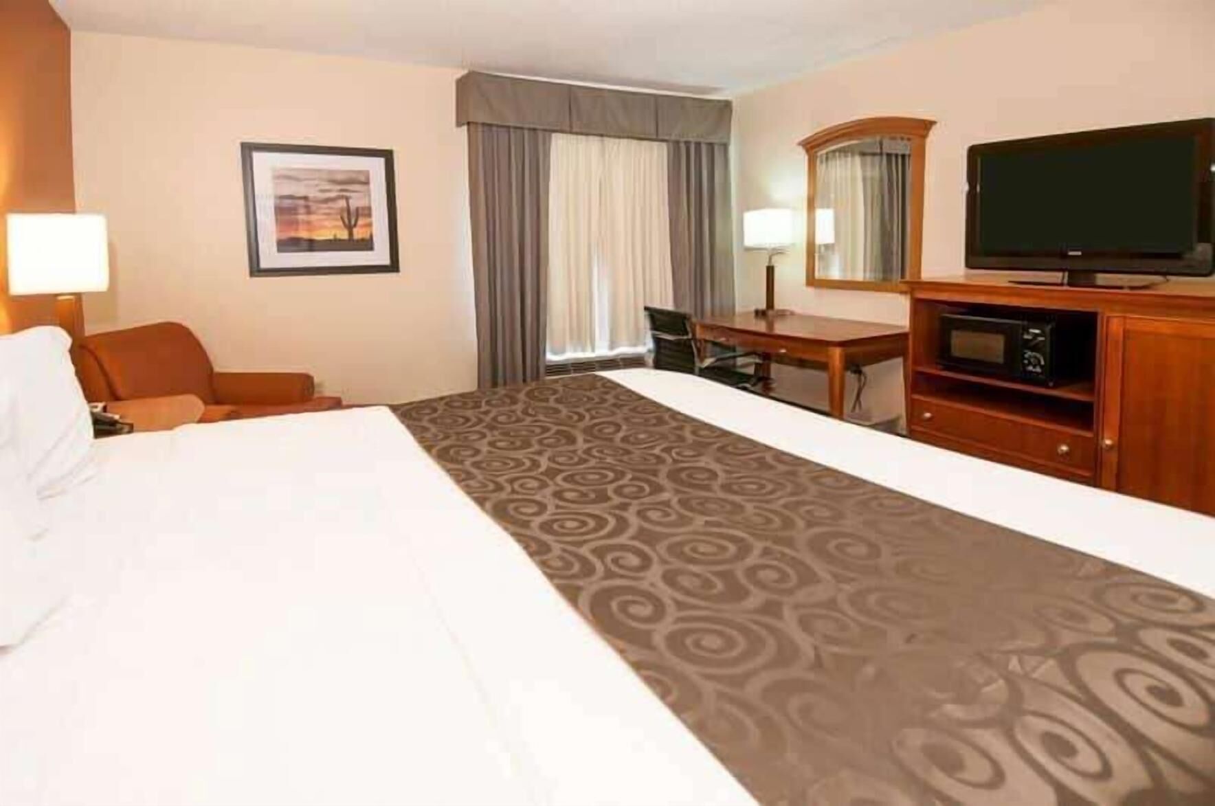 Premium bedding, desk, laptop workspace, blackout curtains