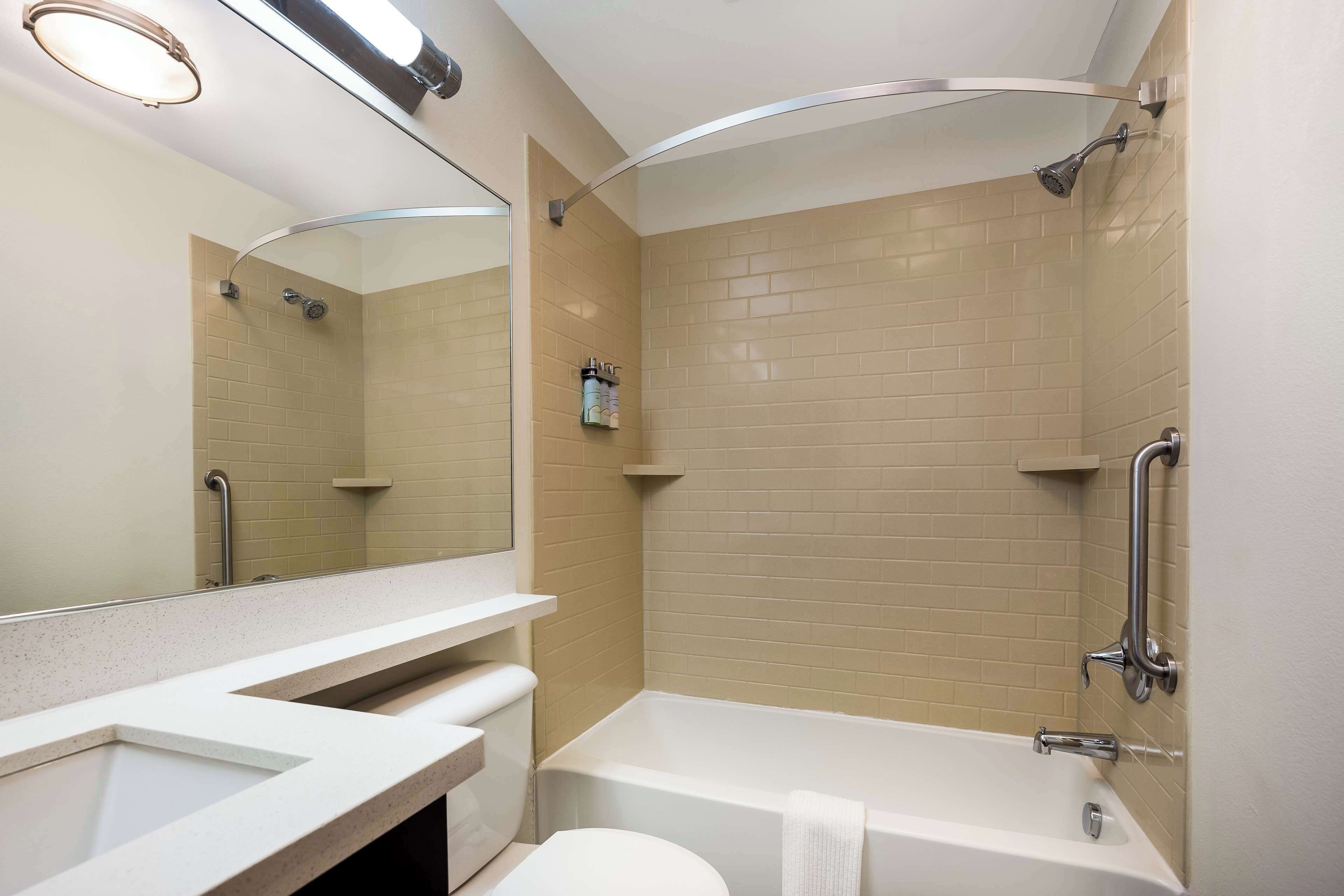 combined shower/bathtub, hair dryer, bathrobes, towels