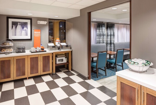 Enjoy meals and socialize in this cozy space with a dining table and chairs, microwave, and coffee station.