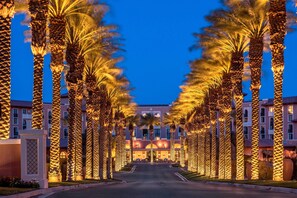 A hotel entrance with a row of palm trees and a building in the background. - The Westin Lake Las Vegas Resort & Spa by Marriott (Henderson)