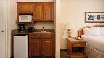 Microwave, coffee/tea maker, cookware/dishes/utensils at Club De Soleil All-Suite Resort