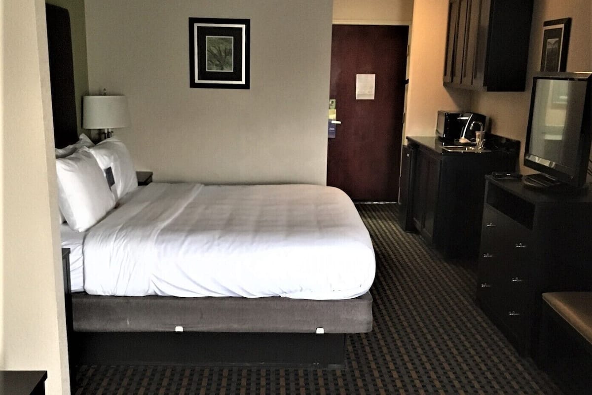 Premium bedding, desk, blackout drapes, iron/ironing board