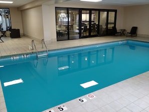 Indoor pool, open 8:00 AM to 10:00 PM, pool loungers