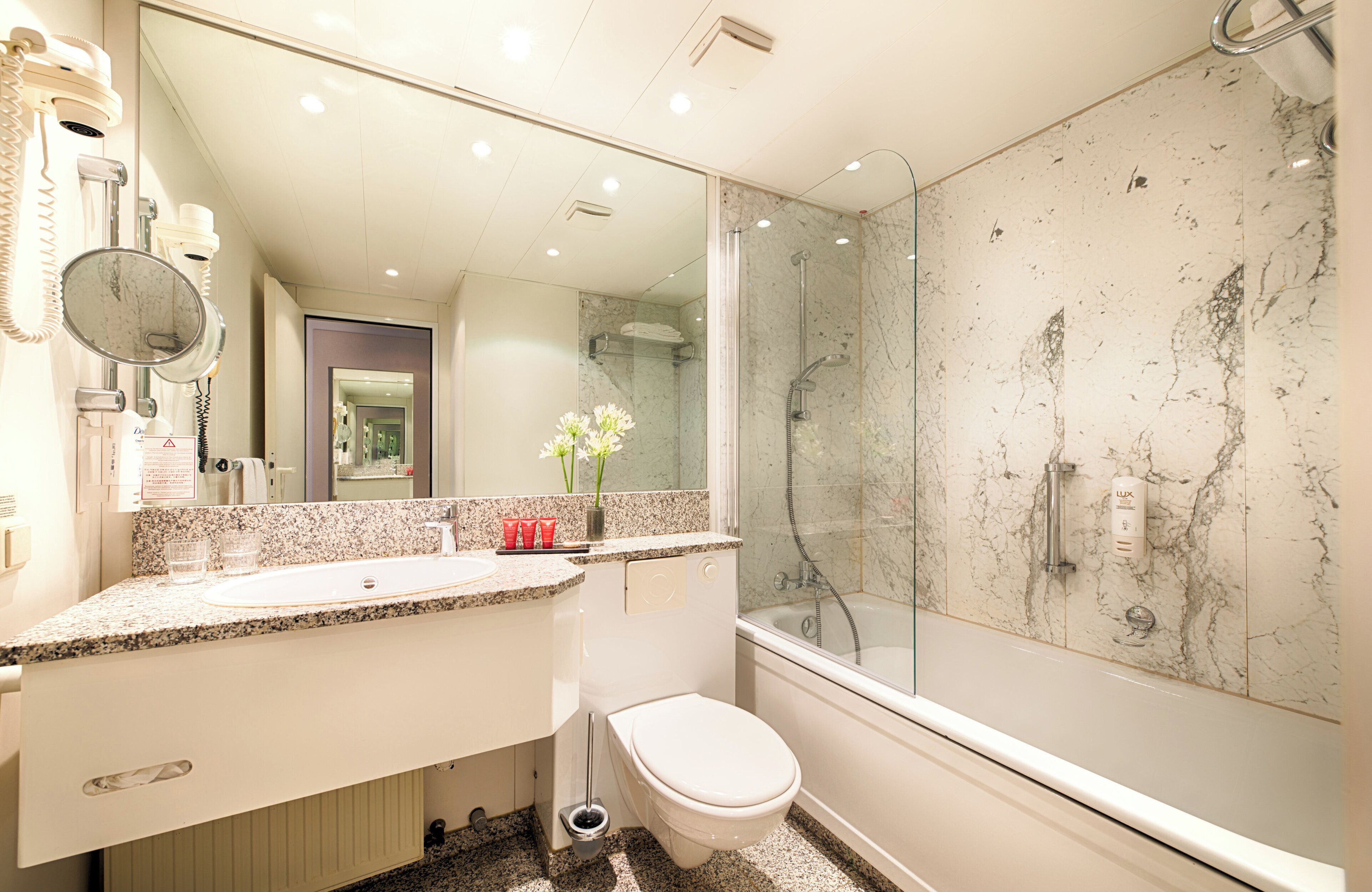 bathtub, free toiletries, hair dryer, towels