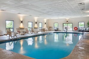 Indoor pool, pool umbrellas, pool loungers