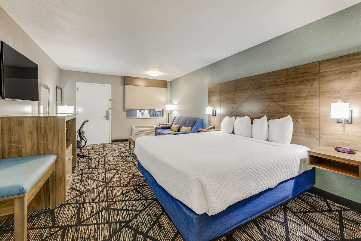 Premium bedding, desk, laptop workspace, iron/ironing board