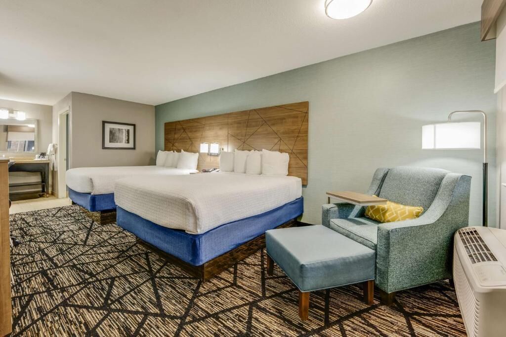 Premium bedding, desk, laptop workspace, iron/ironing board