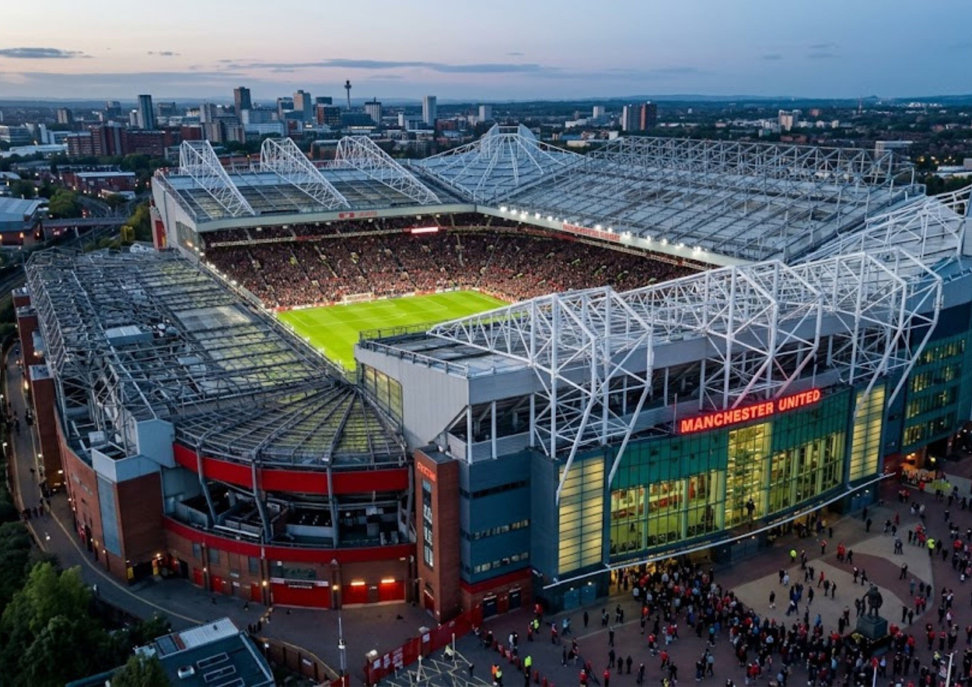 A stadium with a large central field surrounded by tiered seating.