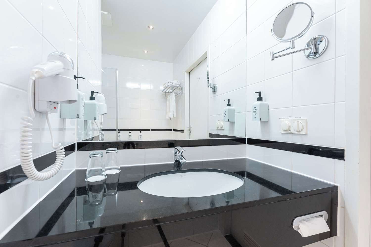 eco-friendly toiletries, hair dryer, towels