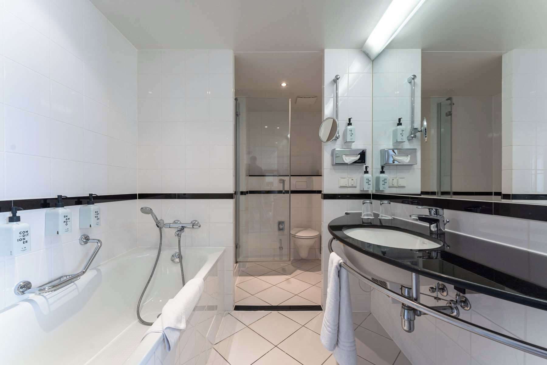 junior suite | bathroom | eco-friendly toiletries, hair dryer, towels
