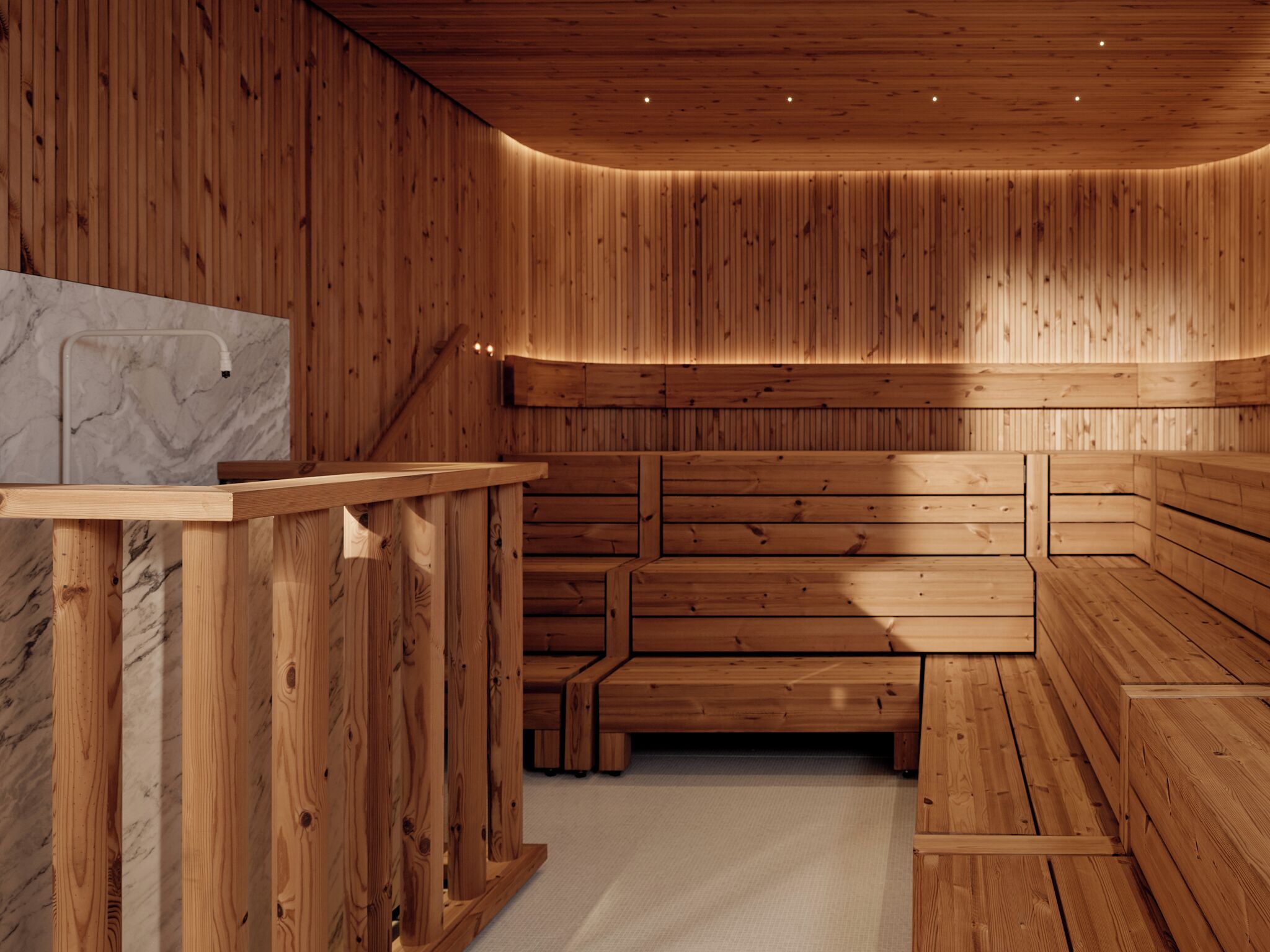 A sauna room with wooden benches and a marble-topped bench.