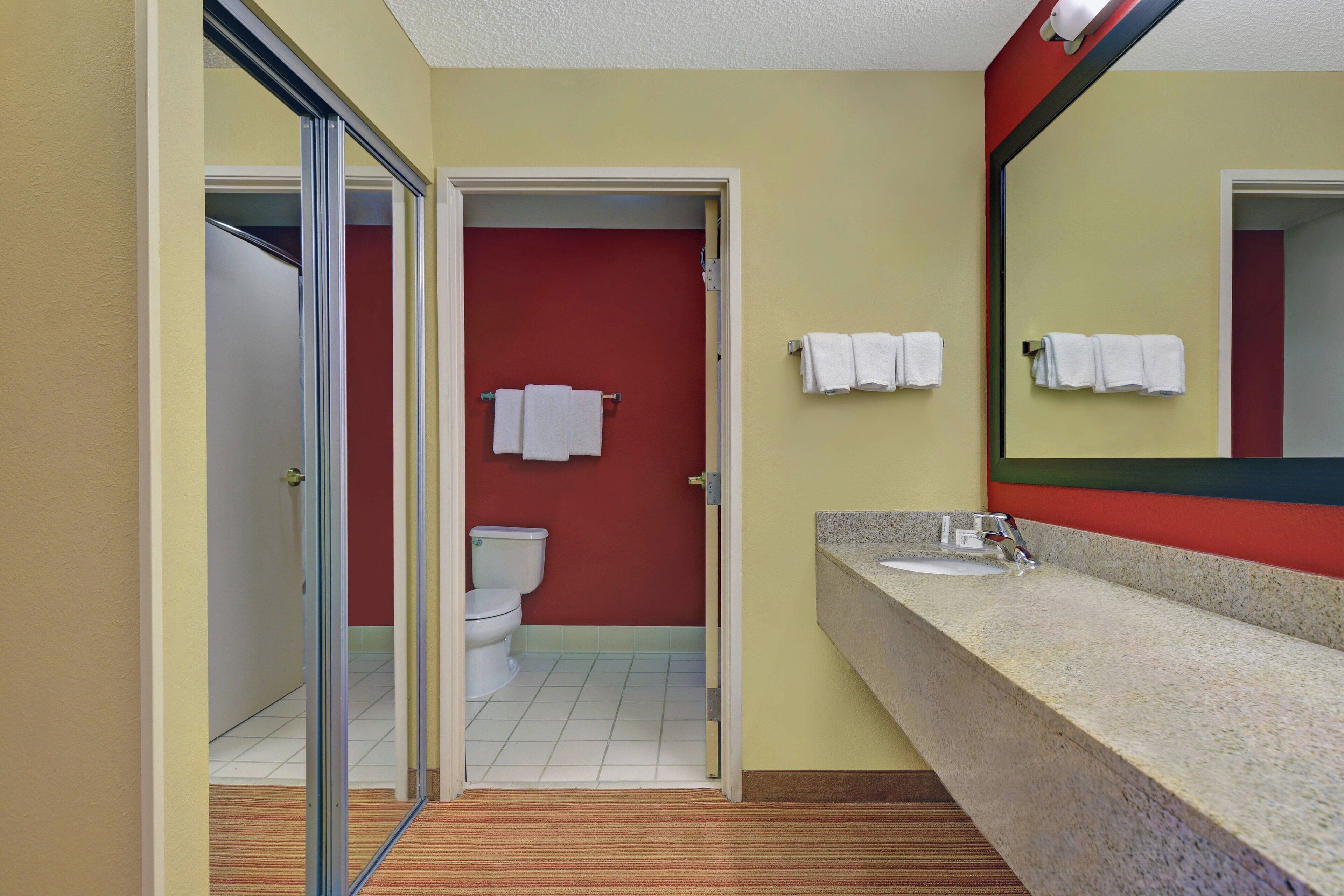 combined shower/bathtub, designer toiletries, hair dryer, towels