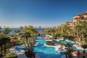 Indoor pool, outdoor pool, pool umbrellas