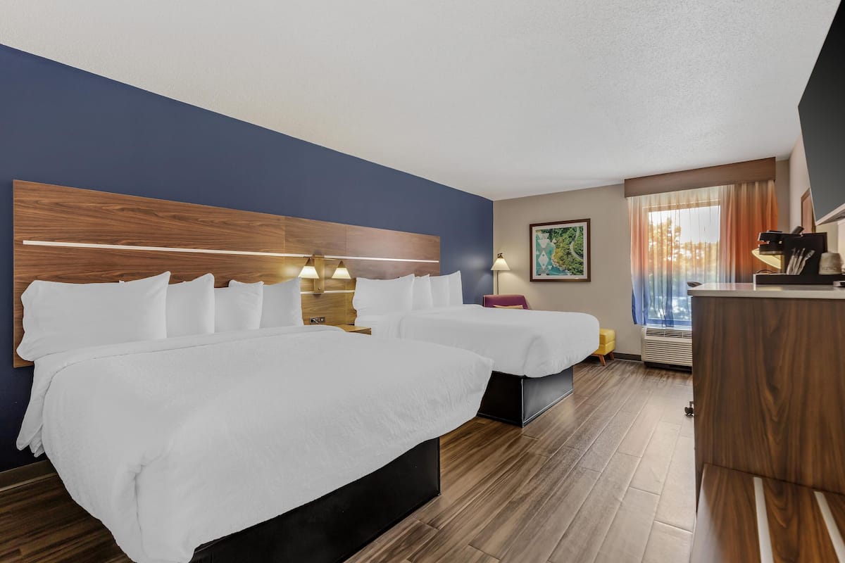 Pillow-top beds, desk, laptop workspace, blackout curtains