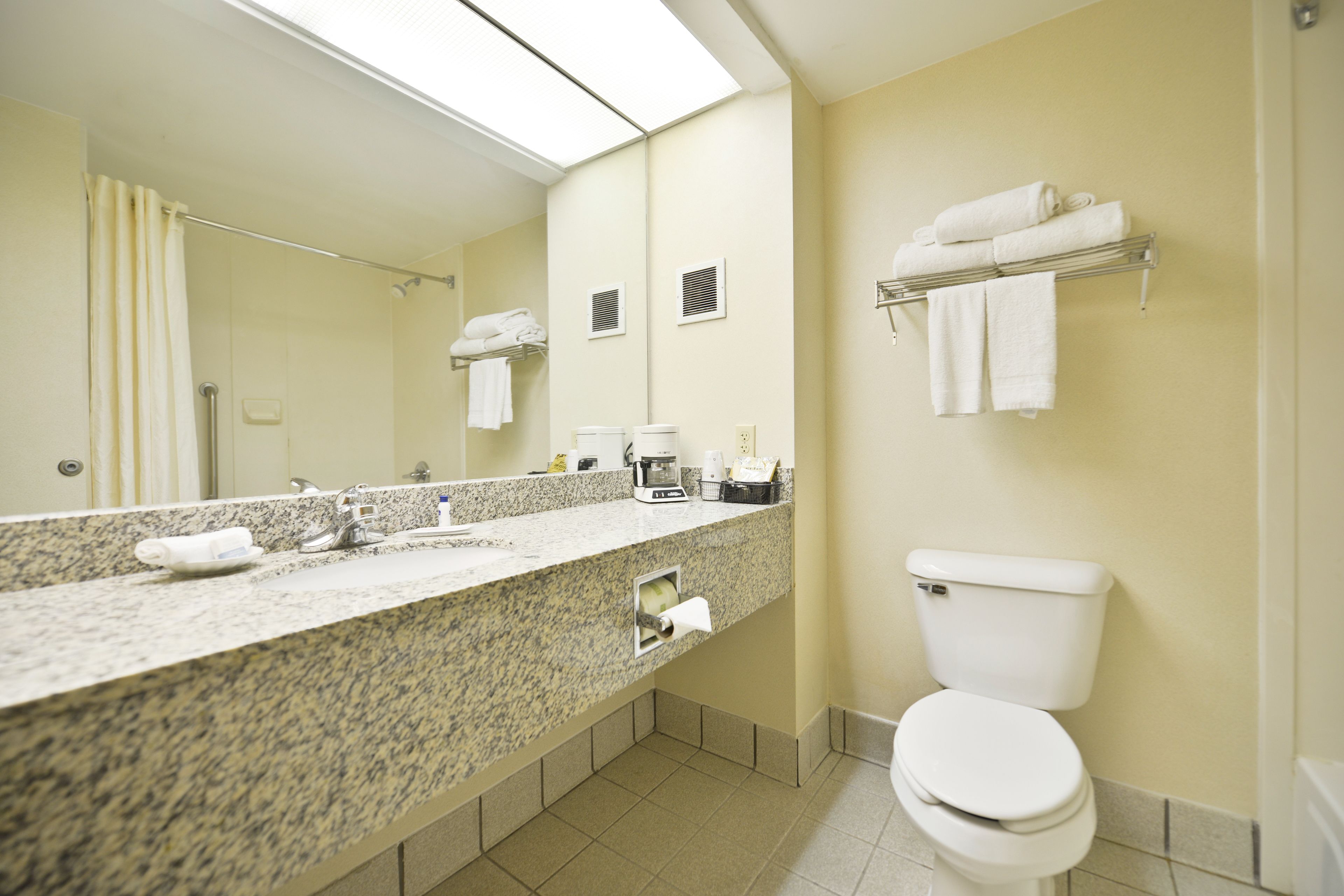 hair dryer, towels, soap, toilet paper