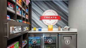 A snack and drink vending area with a sign labeled 'TREATS' and a 'We've got what you need' sign. - Hampton Inn St. Augustine-I-95 (St. Augustine)