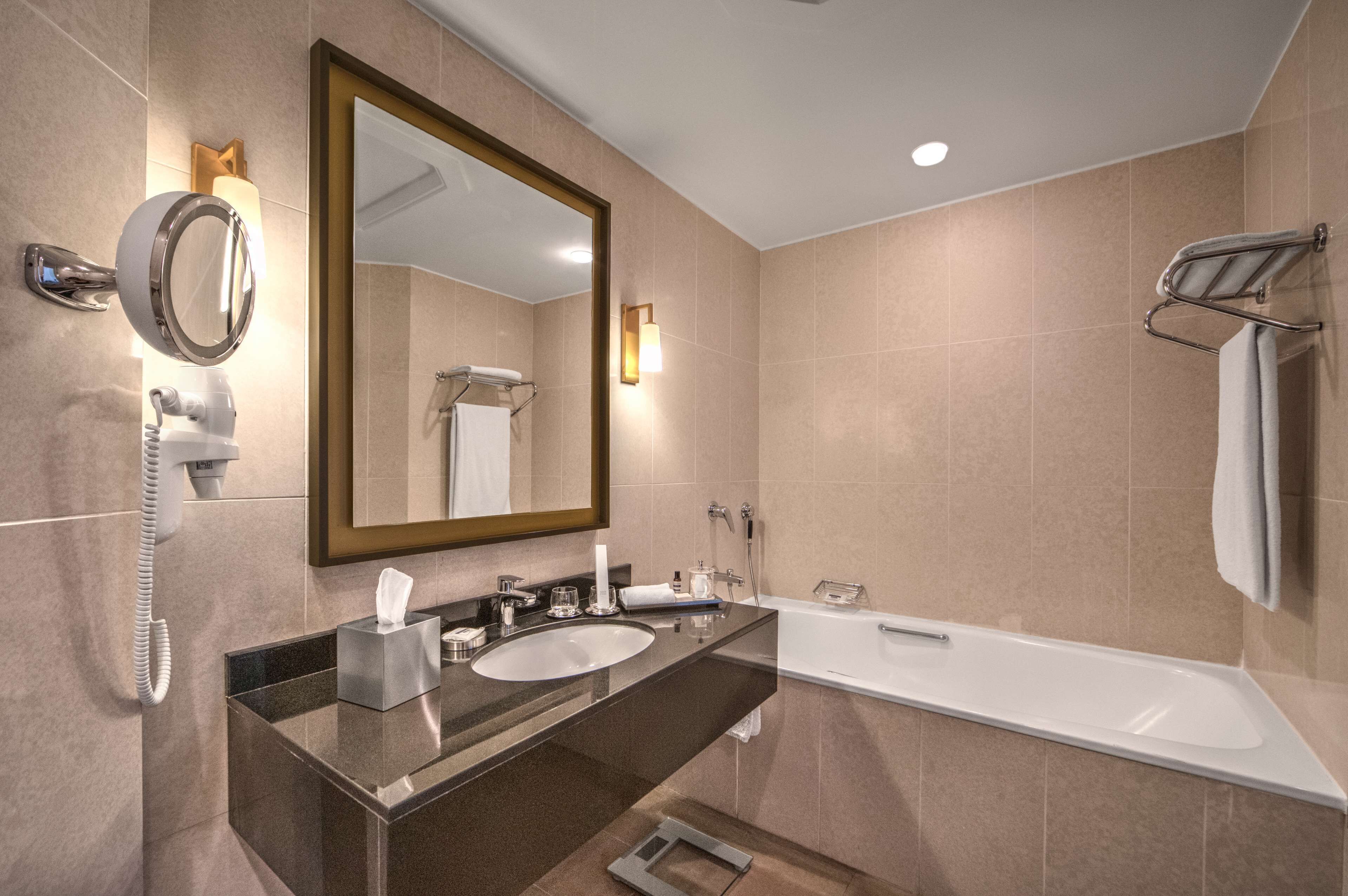 separate bathtub and shower, designer toiletries, hair dryer, bathrobes