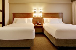 Premium bedding, desk, laptop workspace, blackout drapes