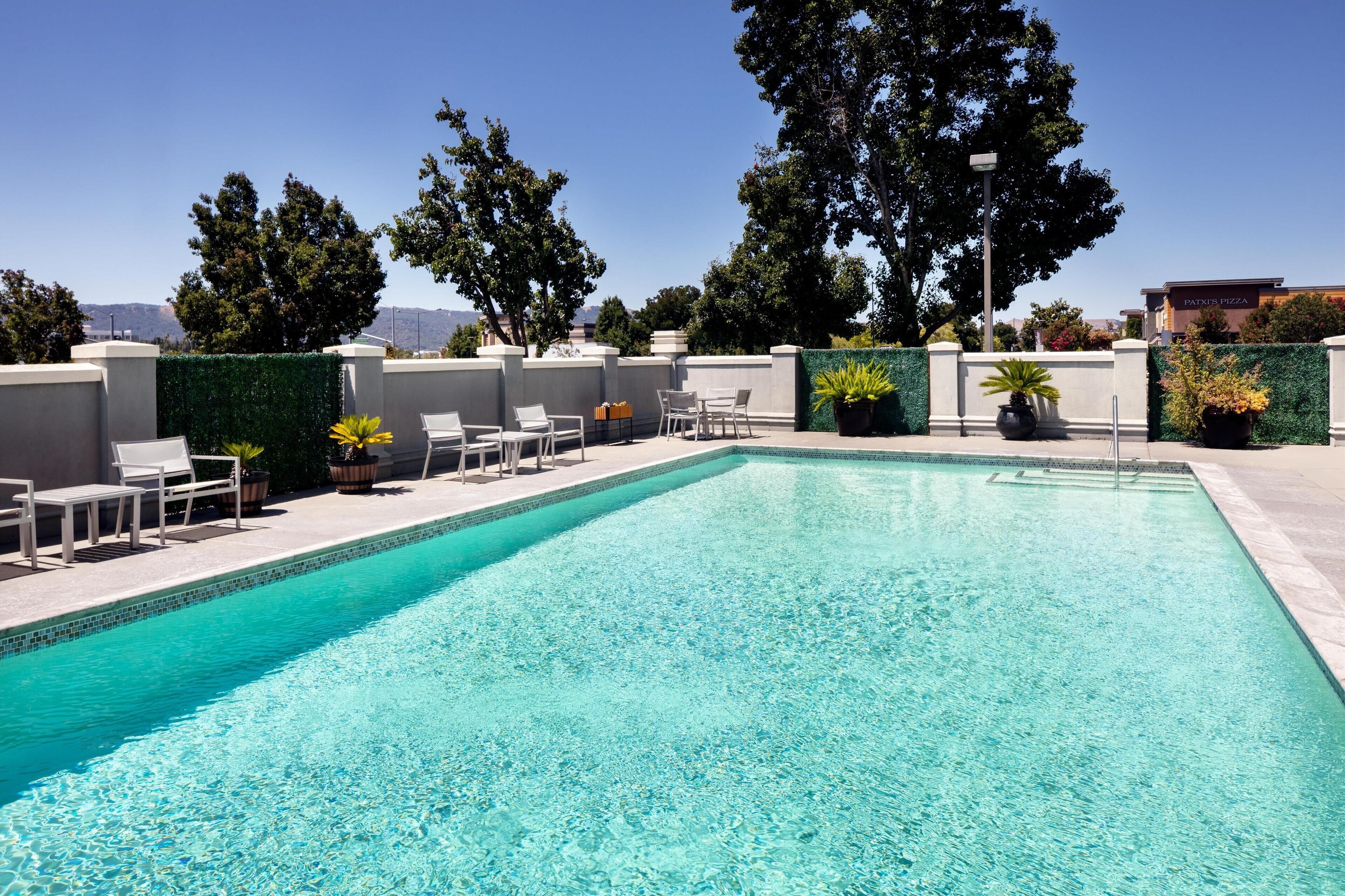 Outdoor pool, open 6:00 AM to 10:00 PM, sun loungers